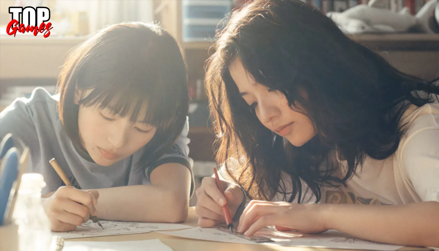 Fujino e Kyomoto disegnano insieme al tavolo in Look Back