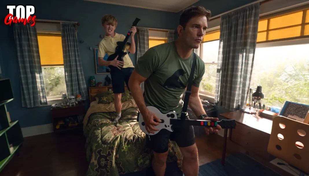 Scuola per guerrieri coraggiosi il trailer con Chris Pratt Chris Pratt e Jude Hill giocano con controller a chitarra in Scuola per guerrieri coraggiosi