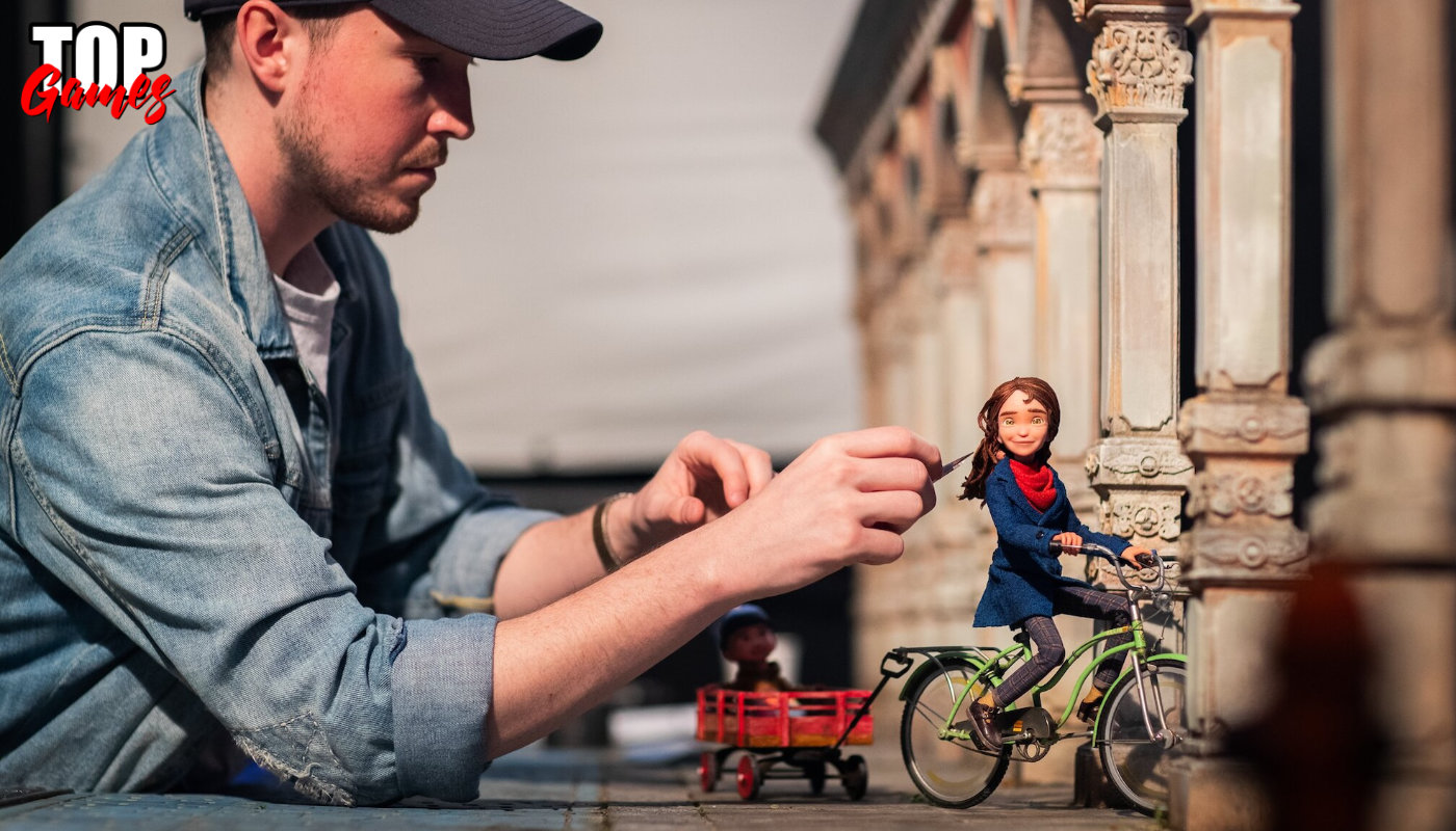 Un animatore lavora al pupazzo di Prue in bicicletta sul set di Wildwood